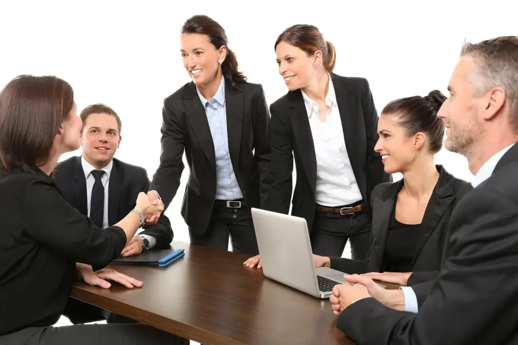 Insurance adjuster talking with a claimant in an office