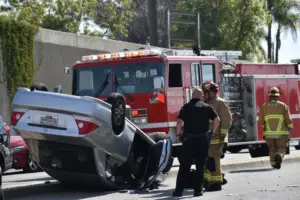 Car accident scene with damaged vehicles and police car