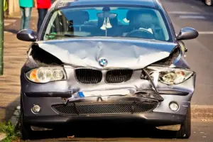 Person taking photos of a car accident scene