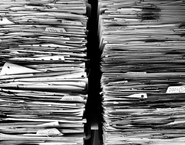 Man organizing appeal documents at a desk