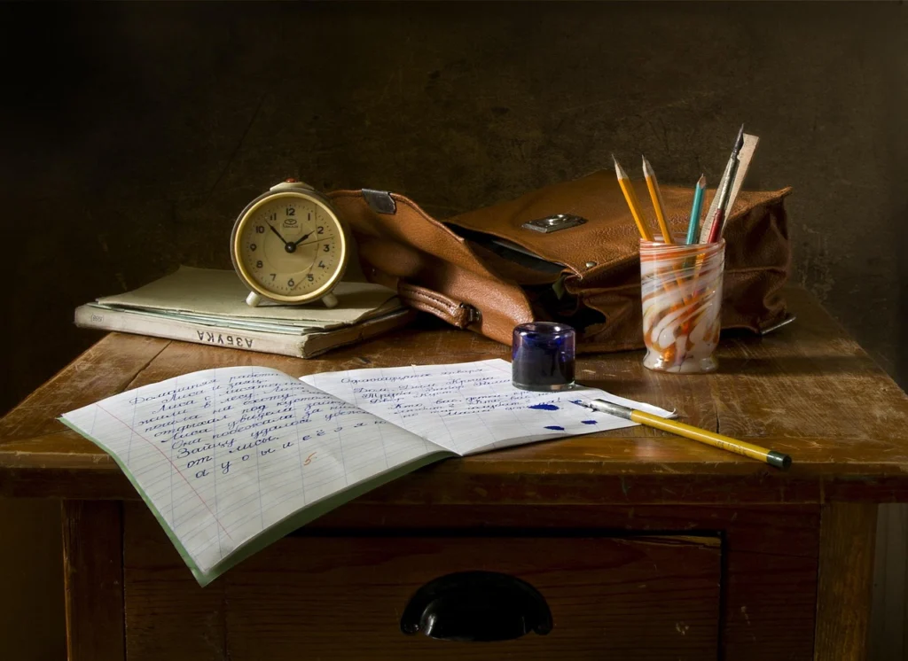 Person writing a demand letter at a desk
